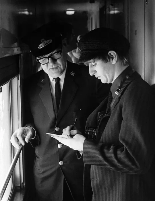 Framed Print : The Beatles February 1964 Drummer Ringo Starr signing an autograph for a train
