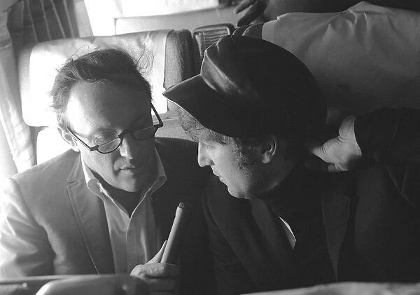 The Beatles February 1964 John Lennon on a train during an interview in America