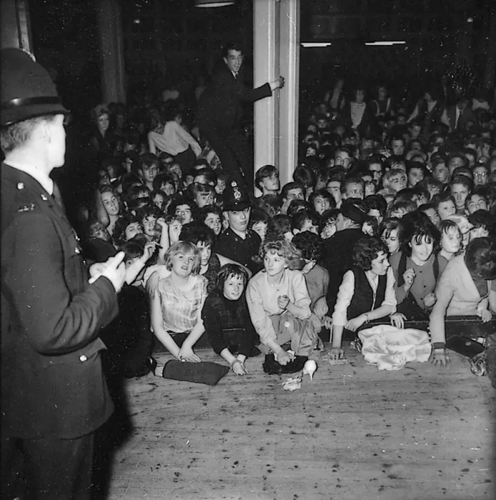 Framed Print : Beatles files 1963 Police on stage during Beatles concert in Derbyshire where fans