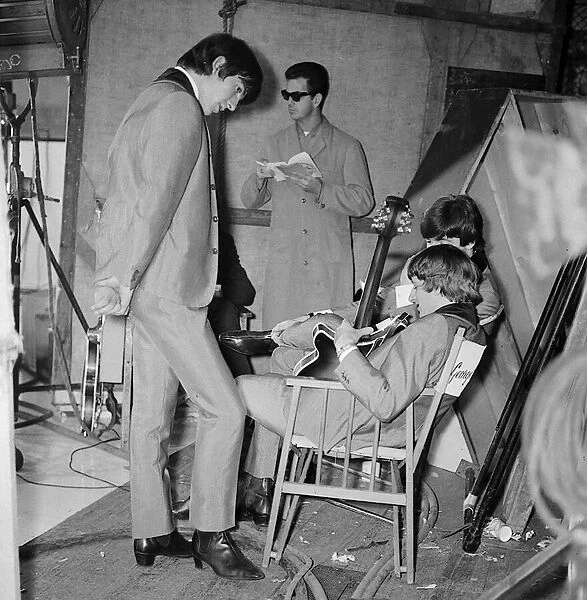 Beatles Files 1964 Ringo Starr George Harrison and John Lennon relaxing during