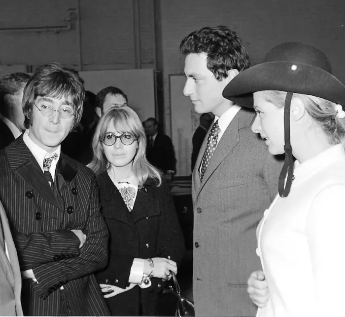 Framed Print : Beatles files 1967. John Lennon & Cynthia at London motor show talking to Framed Print : Beatles files 1967. John Lennon & Cynthia at London motor show talking to