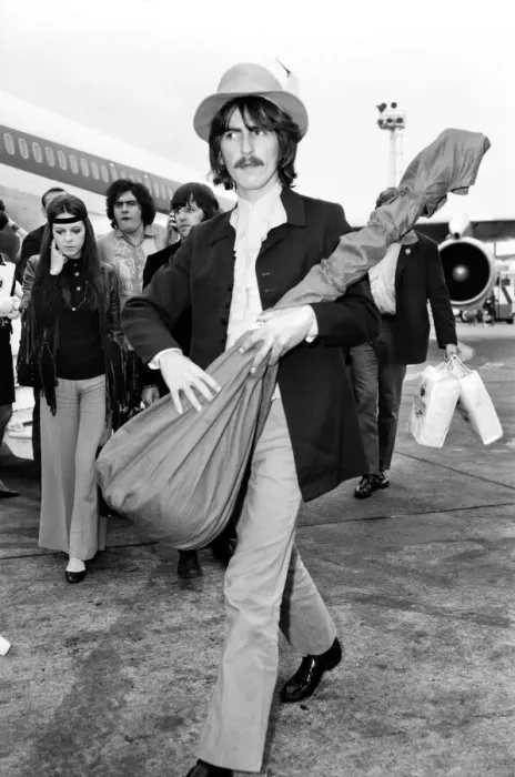 Framed Print : Beatles guitarist George Harrison complete with sitar at Heathrow Framed Print : Beatles guitarist George Harrison complete with sitar at Heathrow