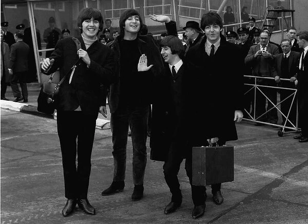 The Beatles leave London Airport bound for the Bahamas to commence filming on their