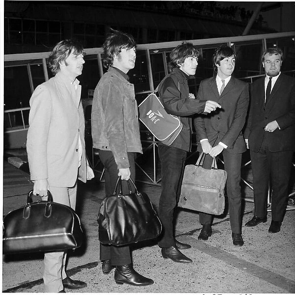 The Beatles at London airport, circa 1965. Left to right: Ringo Starr, John Lennon
