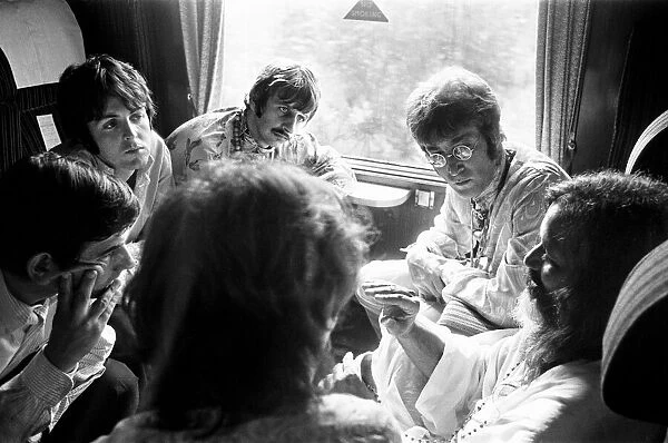The Beatles with Marhirishi Yogi, on a train going to Bangor in North Wales