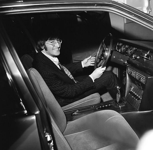 Beatles member John Lennon sits at the wheel of the new Iso Rivolta S4 at the London