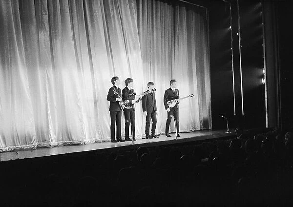 The Beatles performing for the Queen Mother at the Prince of Wales Theatre for the Royal