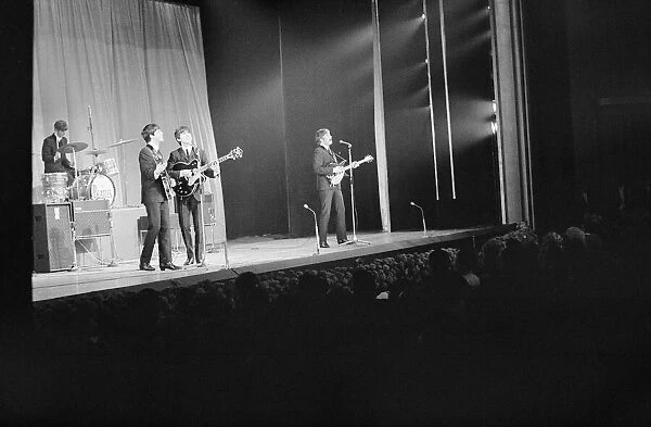 The Beatles performing for the Queen Mother at the Prince of Wales Theatre for the Royal