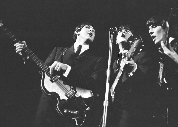 Beatles performing on stage, November 1964. Left to right are: Paul McCartney