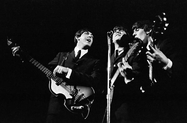 Beatles performing on stage, November 1964. Left to right: Paul McCartney