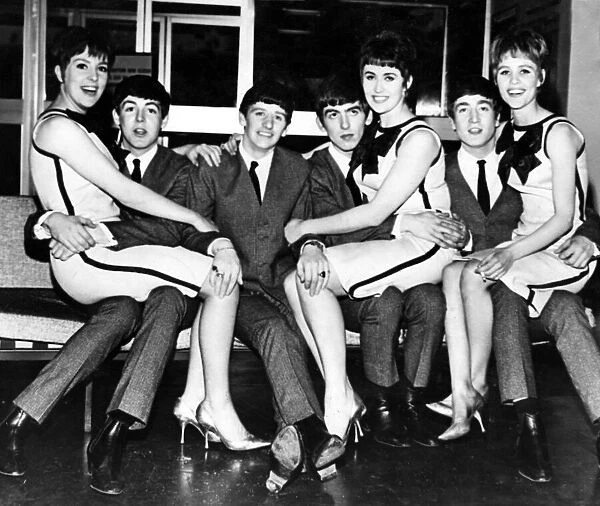 The Beatles pictured with the Vernon Girls during a break in the filming Thank Your Lucky