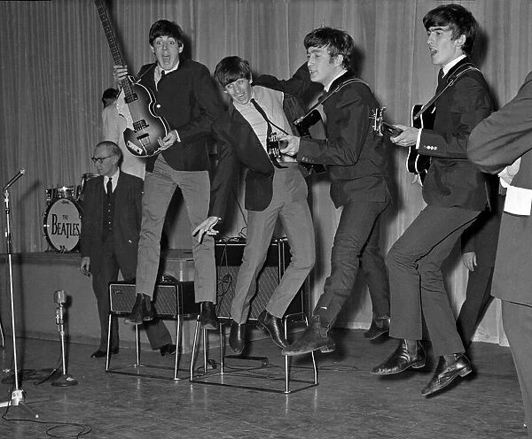 The Beatles play about and jump in the air during the rehearsals for the Royal Variety