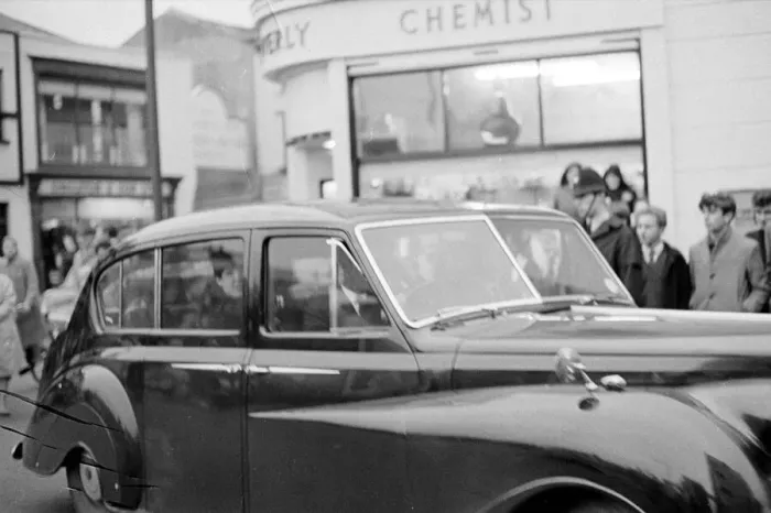 Framed Print : The Beatles - Pop Group - November 1963 Paul McCartney, seen through the car window