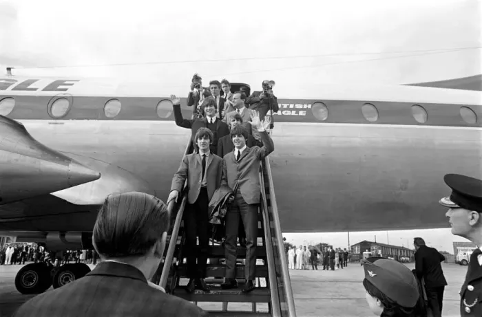 Framed Print : The Beatles pop group wave from the steps of the plane as they arrive in their hometown Framed Print : The Beatles pop group wave from the steps of the plane as they arrive in their hometown