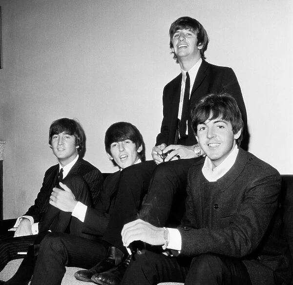 The Beatles pose for a group picture. Left to right: John Lennon, George Harrison
