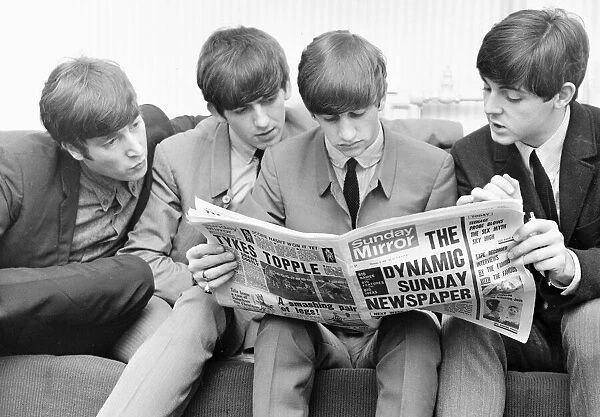 Beatles reading the Sunday Mirror backstage at the Odeon cinema in Leeds