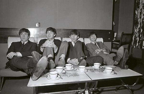 The Beatles relax in their dressing room between the rehearsals for the Royal Variety