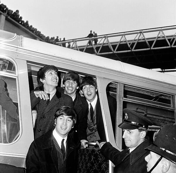 The Beatles return to England after their first American tour. Heathrow Airport, London