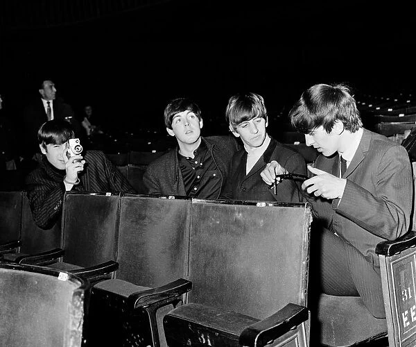 The Beatles at the Ritz Cinema in Belfast. John Lennon taking pictures in Belfast