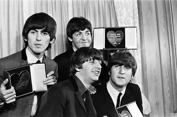 The Beatles with their Variety Club Awards. L-R: Ringo Starr, John Lennon