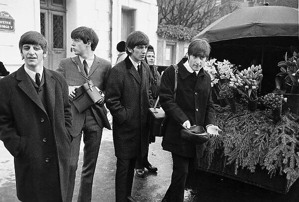 The Beatles walk about in Paris, France during their tour 15 January 1964