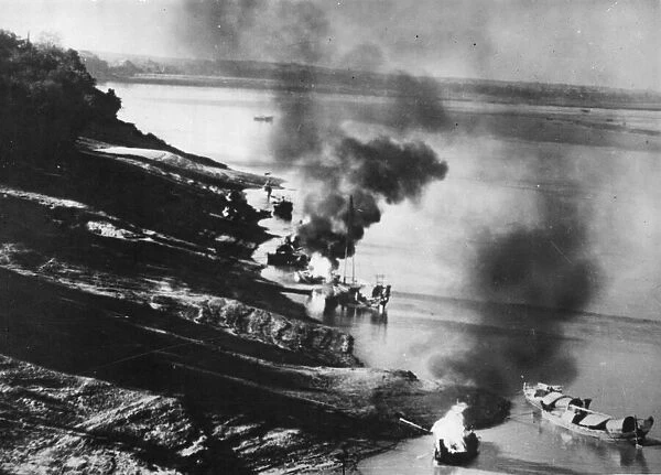 Beaufighters strike at Japanese Rivercraft. Picture shows the scene after a bombing