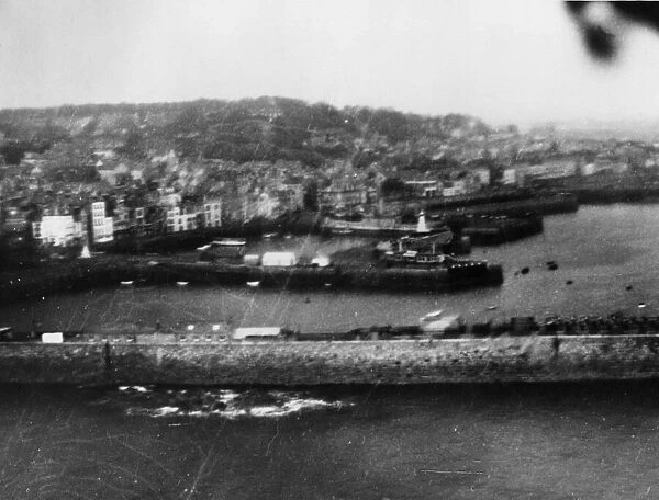 Beaufort aircraft of RAF Coastal Command bomb German ships lying alongside the quay at St