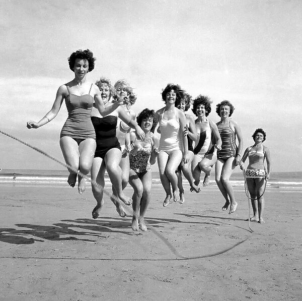 Beauty contest girls playing on the beach at Newquay. 7th July 1960