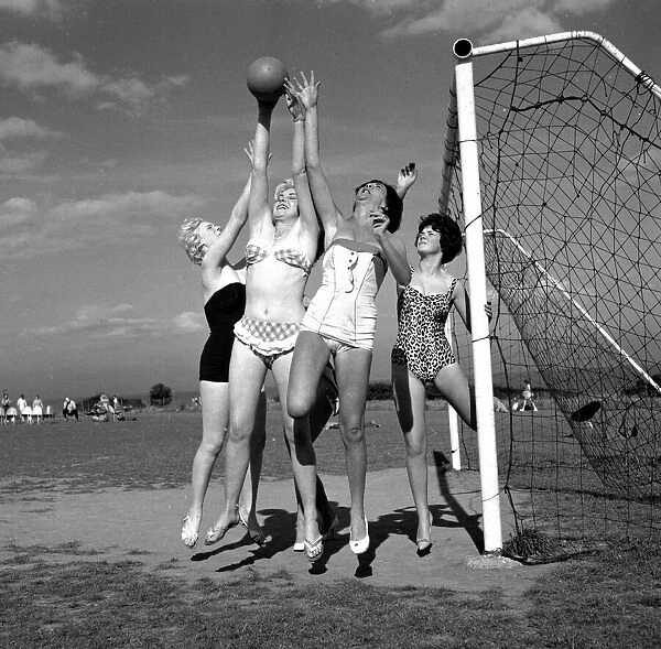 Beauty contest girls playing football at Filey. 30th August 1960