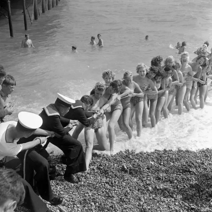 Framed Print : Beauty contest girls playing tug of war with a group of sailors at Southsea, UK Framed Print : Beauty contest girls playing tug of war with a group of sailors at Southsea, UK