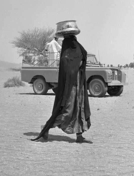 Framed Print : A bedouin woman seen here wearing traditional dress collecting water. July 1965