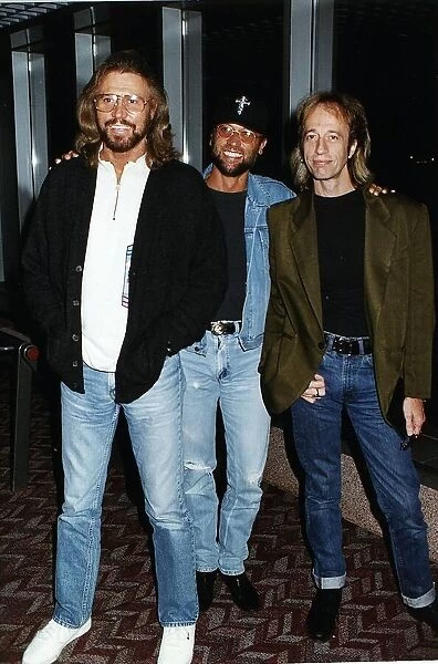Bee gees Pop Group Brothers Barry Maurice and Robin Gibb arrive at Heathrow from New York