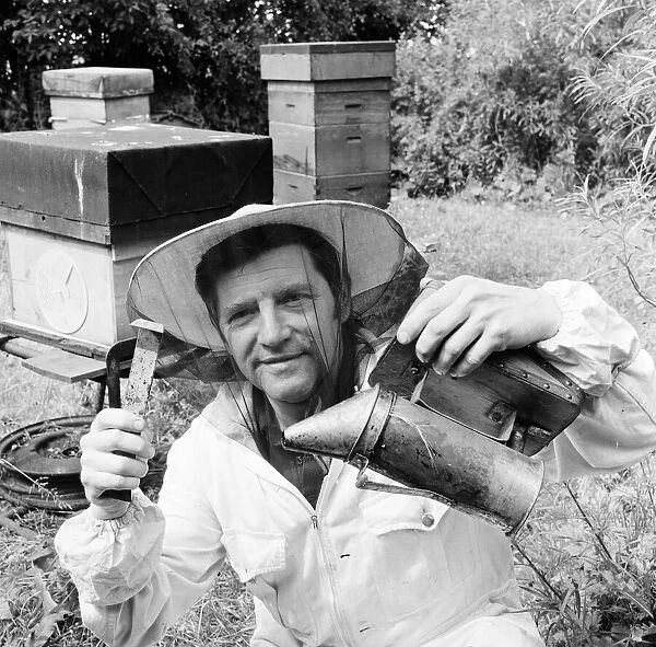 Beekeeper, G Baitey, holding Smoker with heat shield and hook, Newcastle, 22nd July 1971
