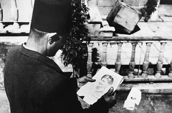 A Beirut citizen looks at a leaflet showing General Montgomery. 28th June 1943