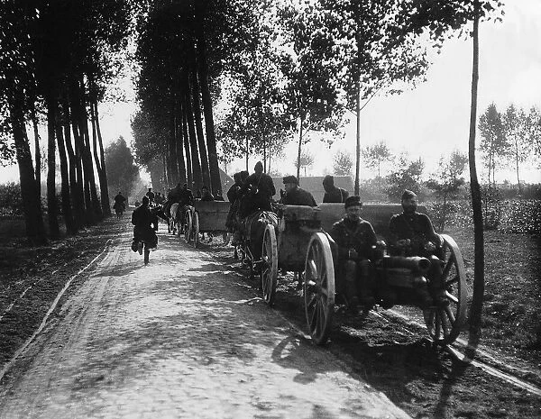 Belgian Army horse drawn gun carriages on a country road in Belgium