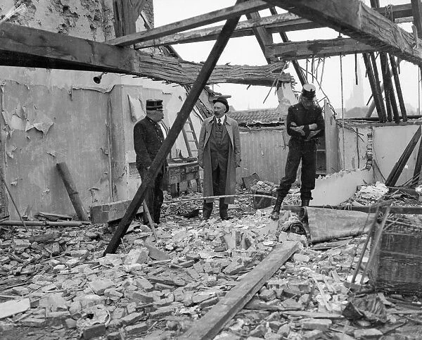 Belgian Army officers inspect telegraph  /  radio office damaged in Antwerp the result of