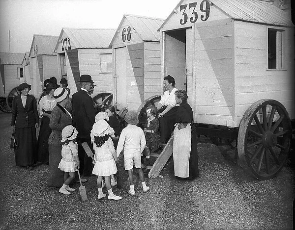 Belgian refugees in Ostend make themselves comfortable in bathing machines. 1914