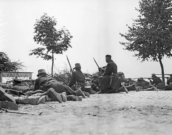 Belgian riflemen lying on the road facing the German advance at Louvain