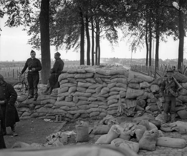 Belgian soldiers and Royal Marines from the Naval Brigade seen here manning a barricade