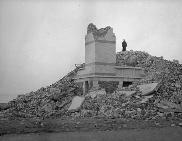 Belgian soldiers seen here inspecting the remains of a residential villa near Dunkirk