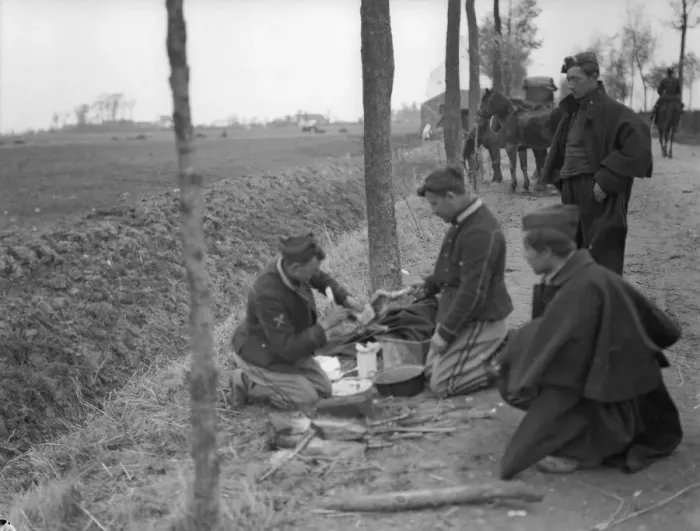 Framed Print : Belgian soldiers seen here preparing a chicken for the pot during a respite in the recent