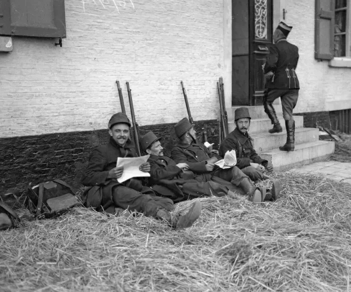 Framed Print : Belgian soldiers seen here resting and catching up with the news at Diest