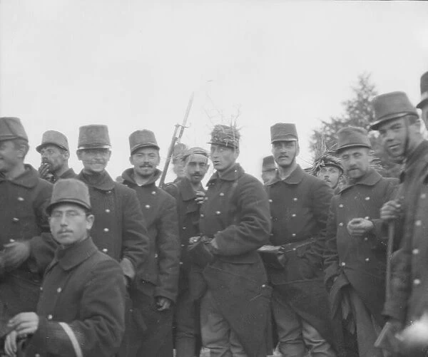 Belgian soldiers with straw round their hats to disguise their appearance from the enemy