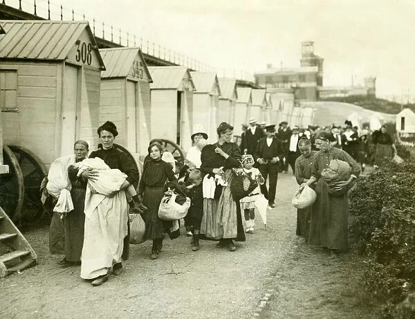 Belgian Women refugees carrying their belongins arriving in the belguim town of Ostend