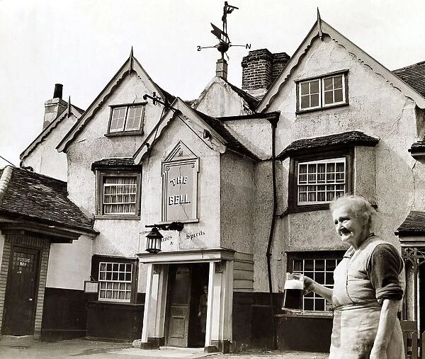 The Bell Inn Public House Pubin Molesey - July 1943 An elderly woman with a pint of