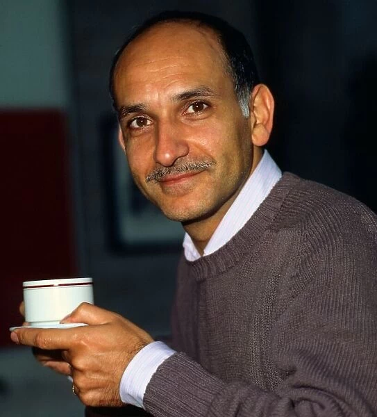 Ben Kingsley holding cup of tea June 1983
