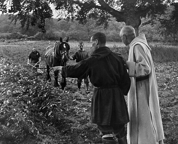Benedictine monks work hard to help food production. October 1943 P011617