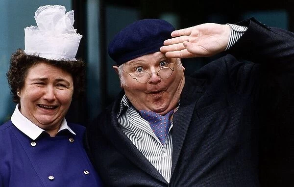 Benny Hill Comedian standing with a matron nurse does his impression of Fred Scuttle as