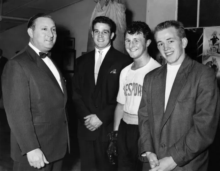 Framed Print : Benny Jacobs with some of his happy family'. Next to him is Phil Edwards then