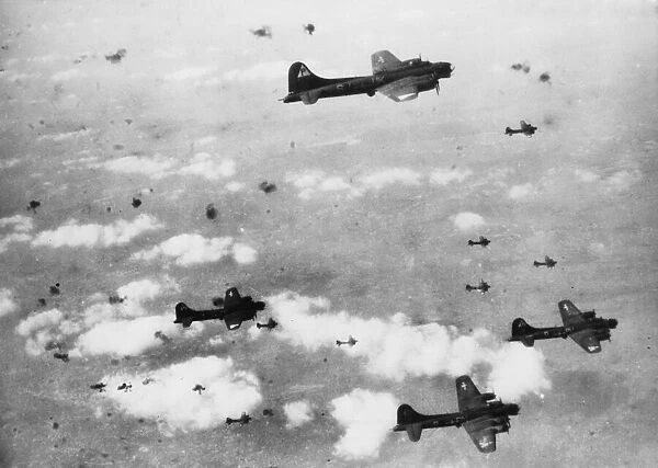 Berlin Flak. U. S. Eighth Air Force flying Fortresses pass through a flak filled shy